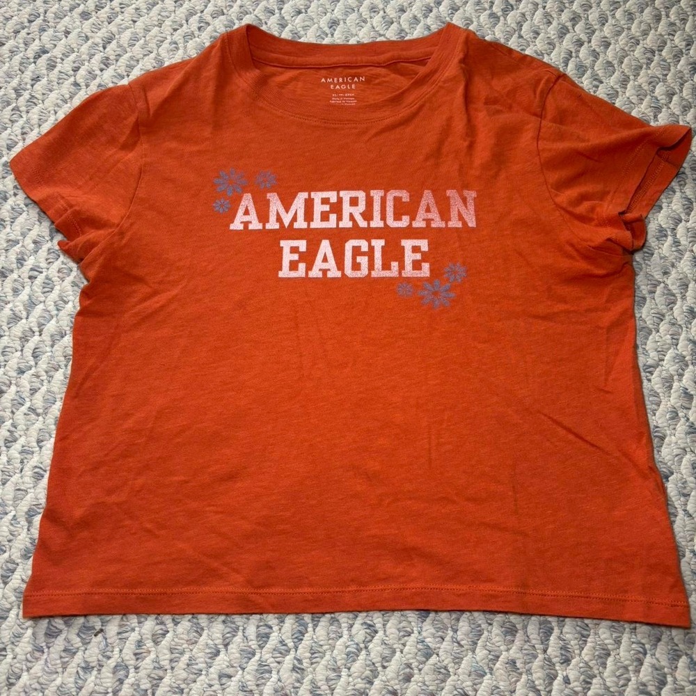 American Eagle baby doll orange graphic tee Size XS but fits like a medium!